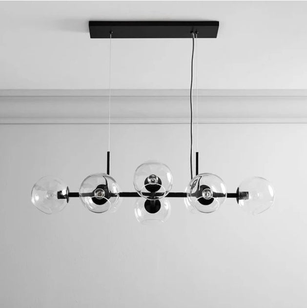 Sleek glass-ball pendant light luxury contemporary kitchen island